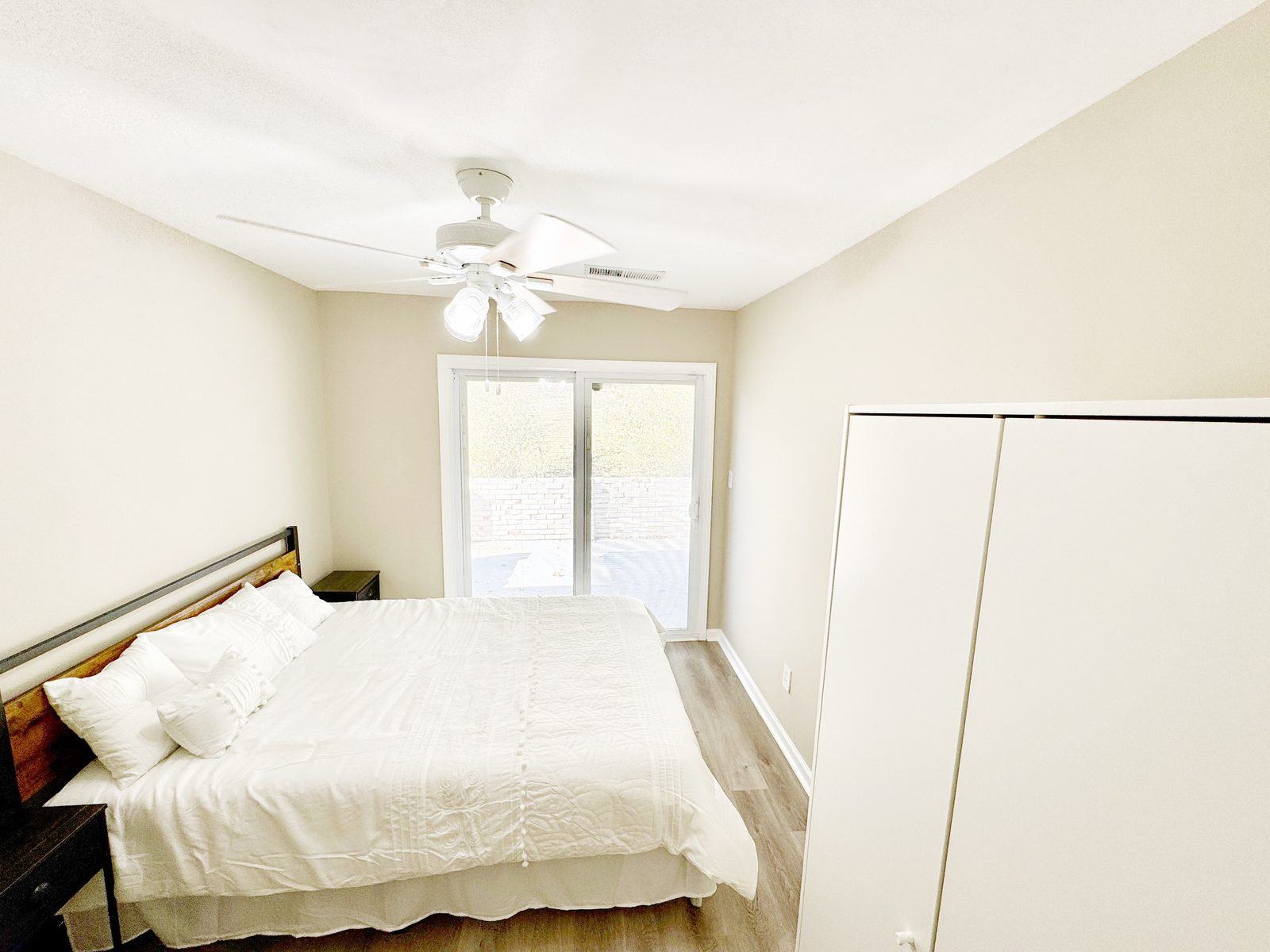 Room 5: bedroom with its own sliding patio door, wardrobe and desk